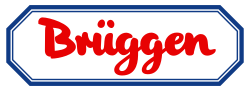 Roter, geschwungener Schriftzug Brüggen in einem blau umrandeten, achteckigen Rahmen auf weißem Hintergrund.